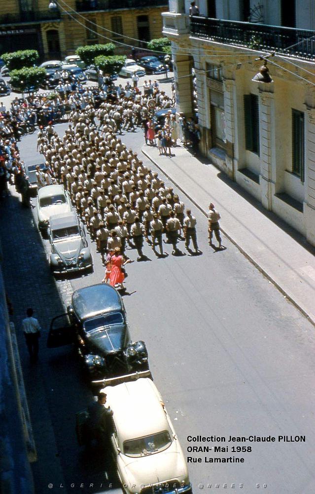 ORAN MAI 58-ORAN PAVOISE RUE-LAMARTINE-RETOUR TROUPES.jpg